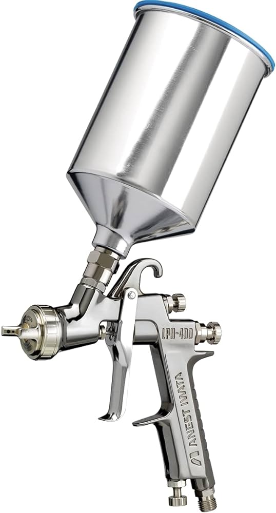 A spray gun with a metal funnel on top of it.