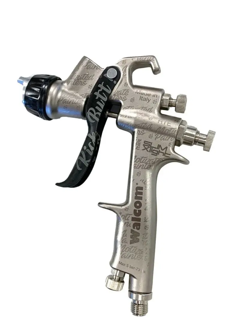 A spray gun with the handle extended and the nozzle attached.