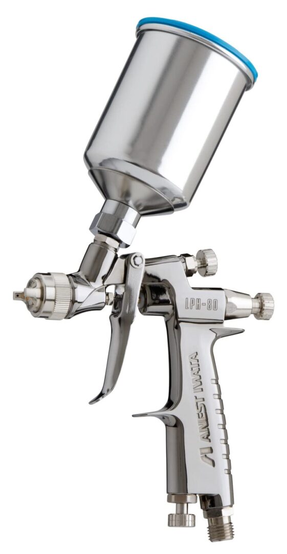 A spray gun with a metal cup on it.